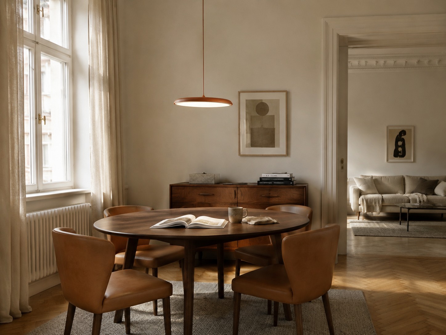 Slim pendant light positioned above a dining table