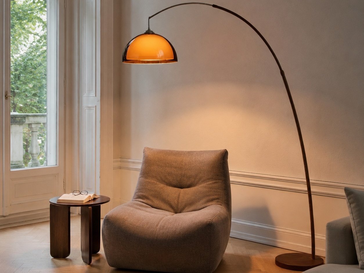 Arched amber floor lamp creating a warm reading corner