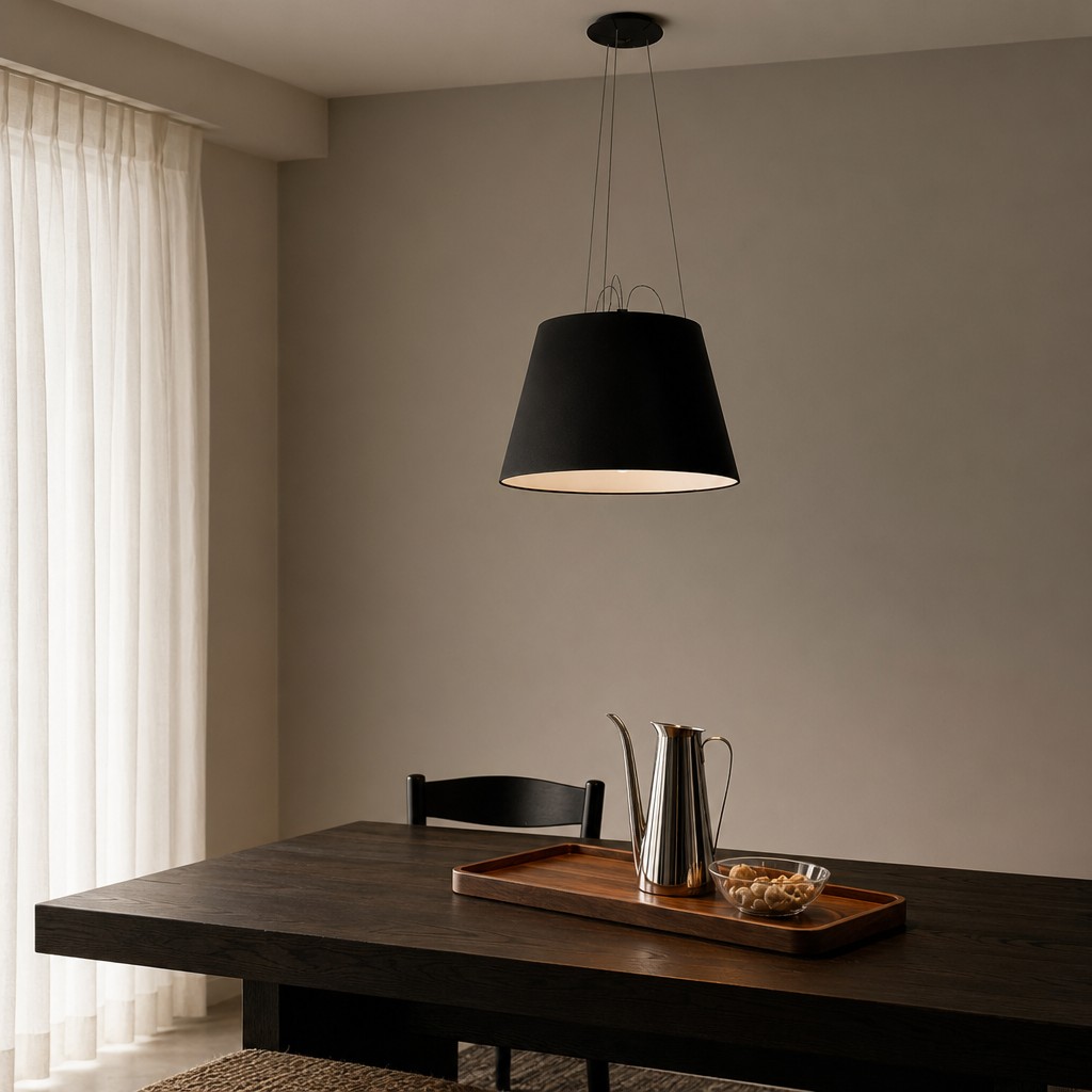 Black Tolomeo Mega pendant lamp above dining table