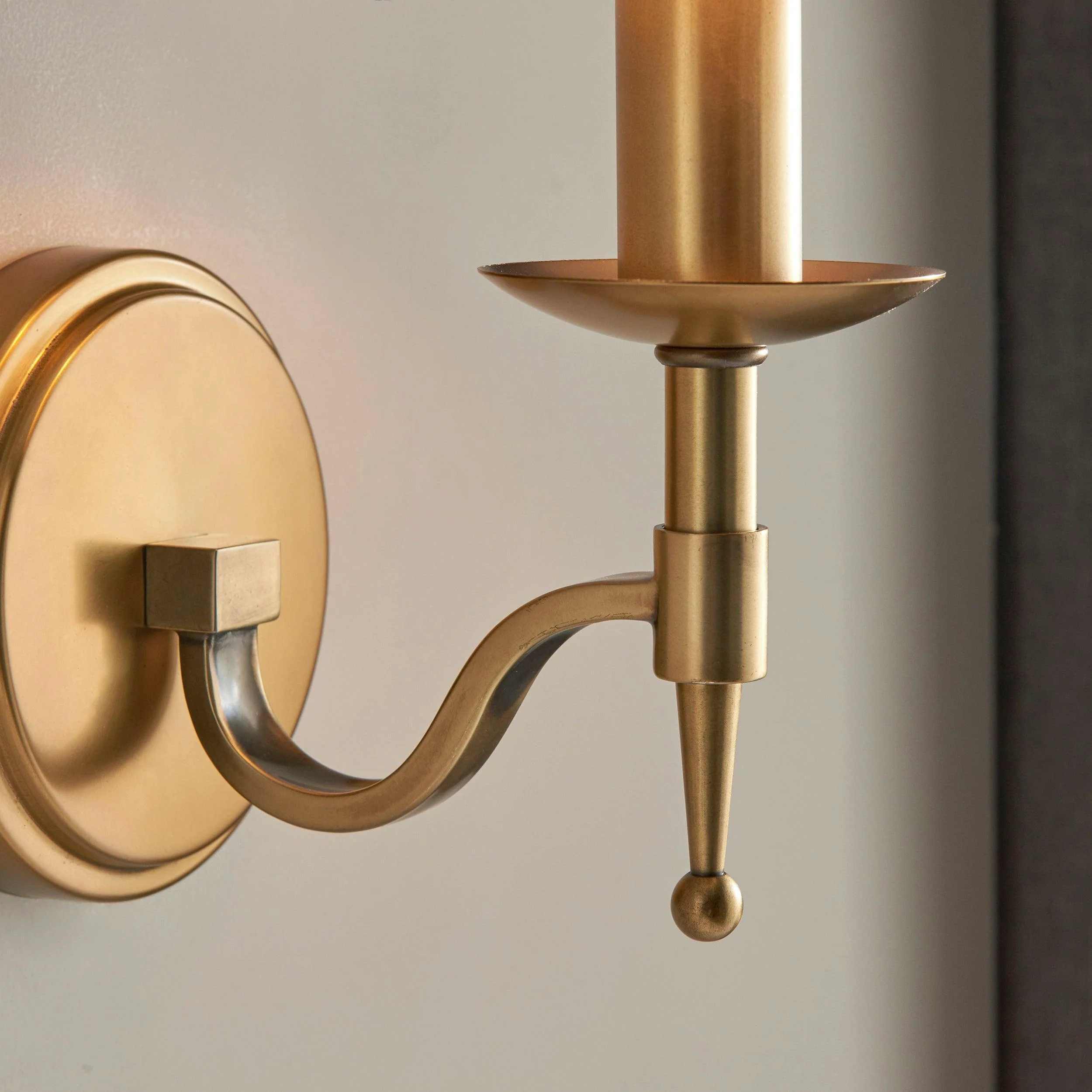 Close-up of Tela brass arm and candle cup detail
