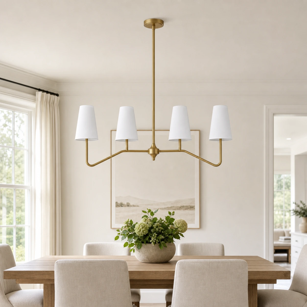 Strellux brass linear chandelier in a dining room setting