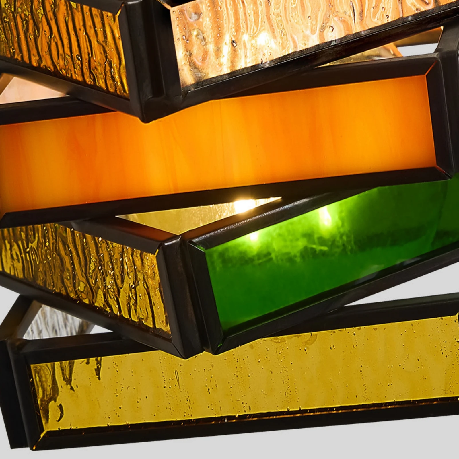 Textured amber green and clear glass shade detail