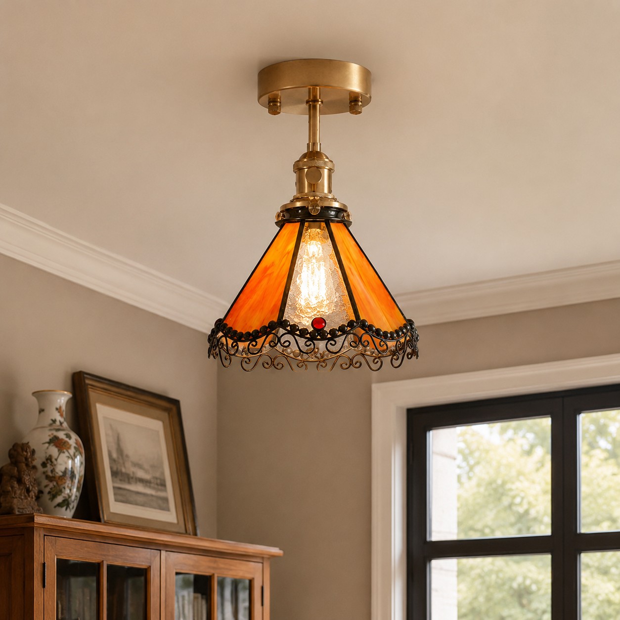 Orange stained glass ceiling light above a cabinet corner