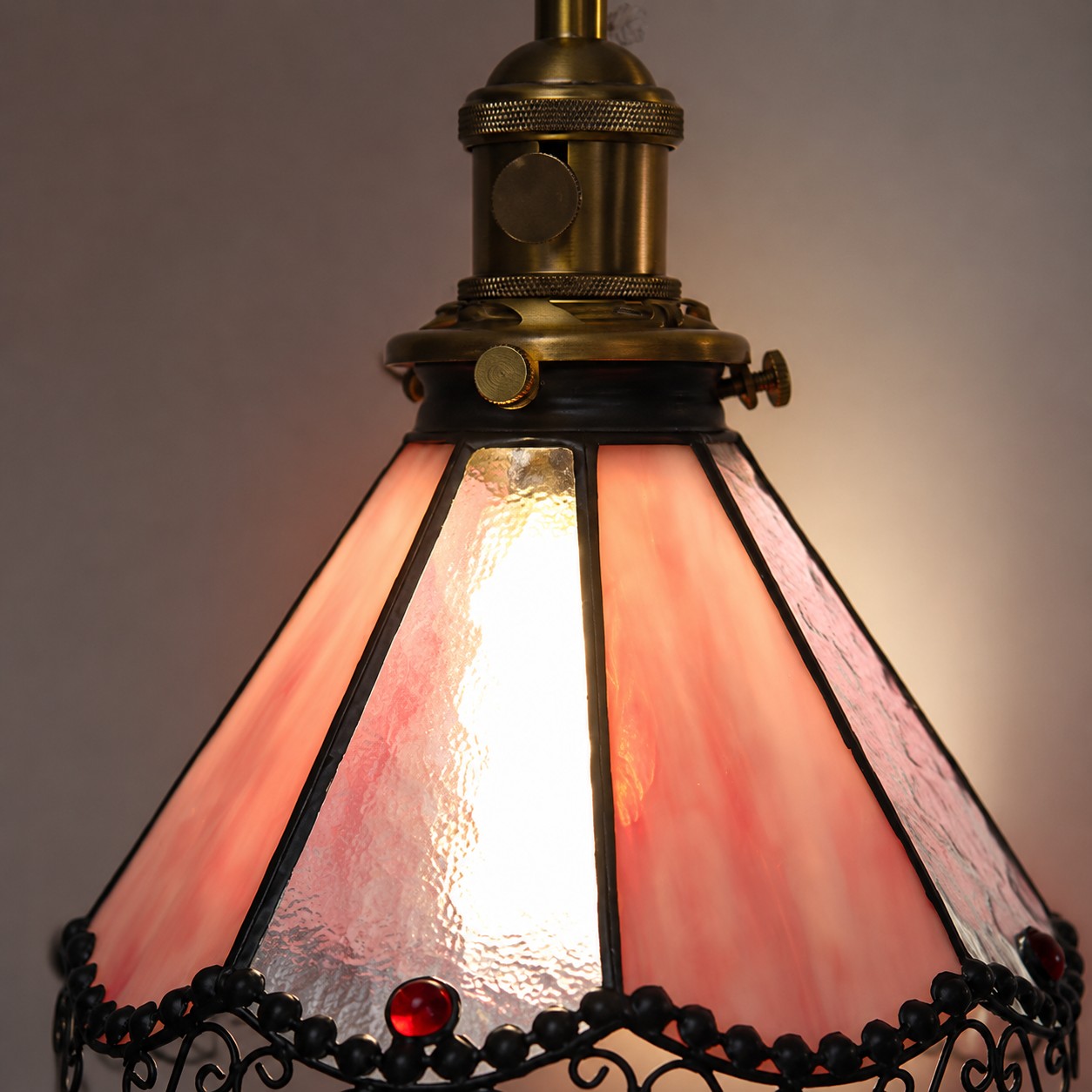 Close detail of pink stained glass shade