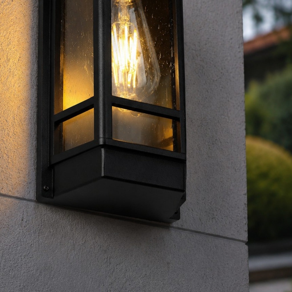 Black glass outdoor wall sconce lower frame detail