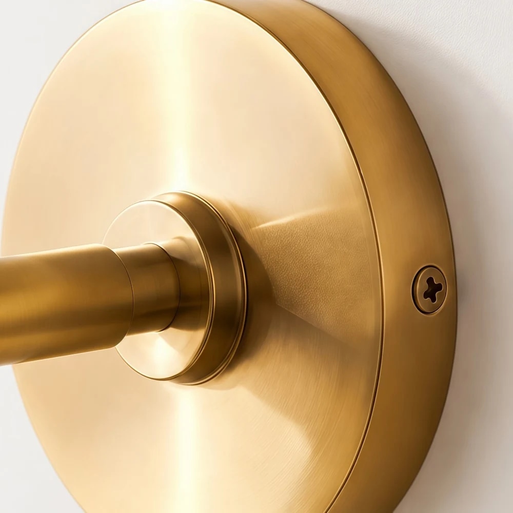 Gold wall plate and arm detail