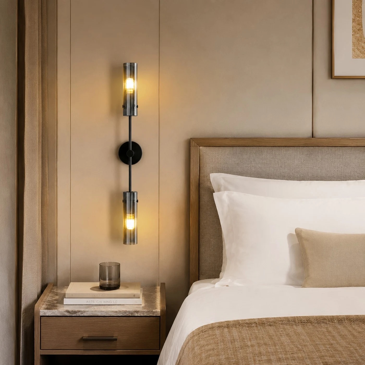 Black copper two-head alabaster wall sconce installed beside a bed