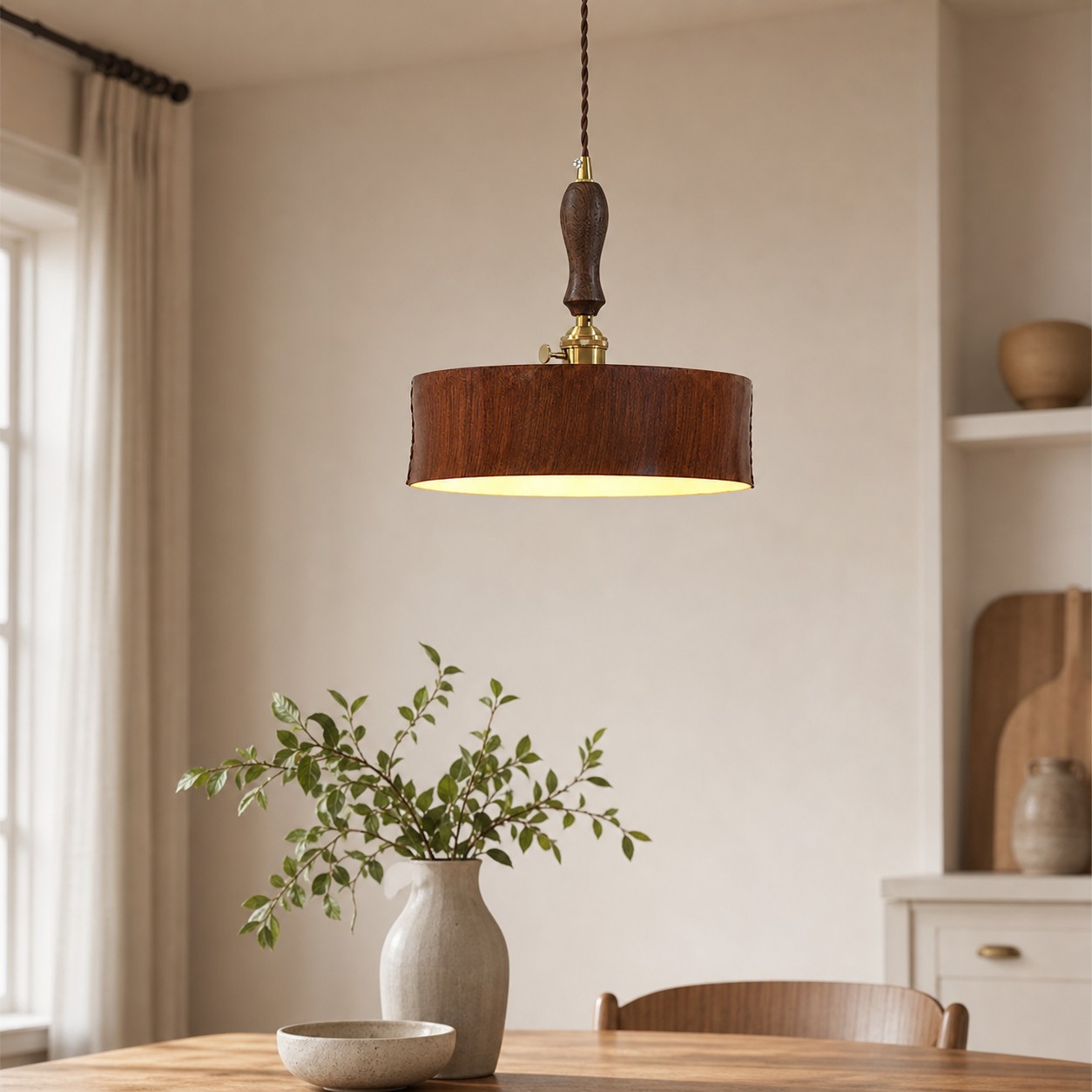 Vintage brown leather pendant installed over a quiet dining nook