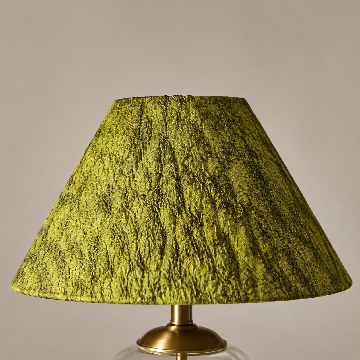 Close view of the green textured fabric lampshade