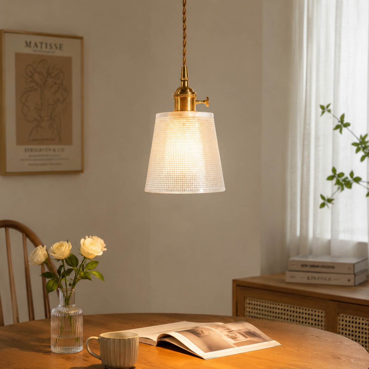 Interior lifestyle view with one ribbed glass pendant over a table