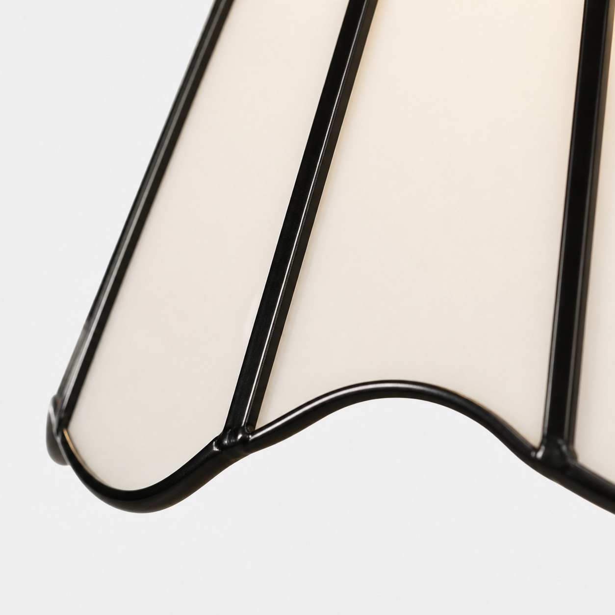 Scalloped glass shade edge with black trim