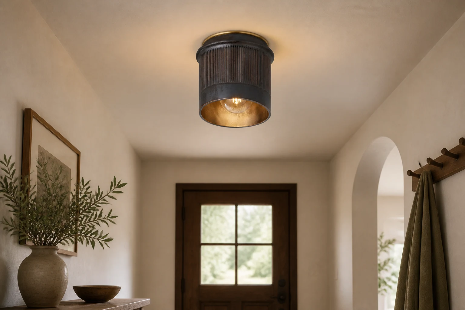 Rustic black flush mount ceiling light in a styled interior scene