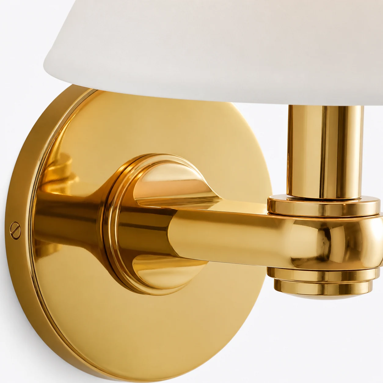 Close-up detail of the Roven metal wall light finish and shade
