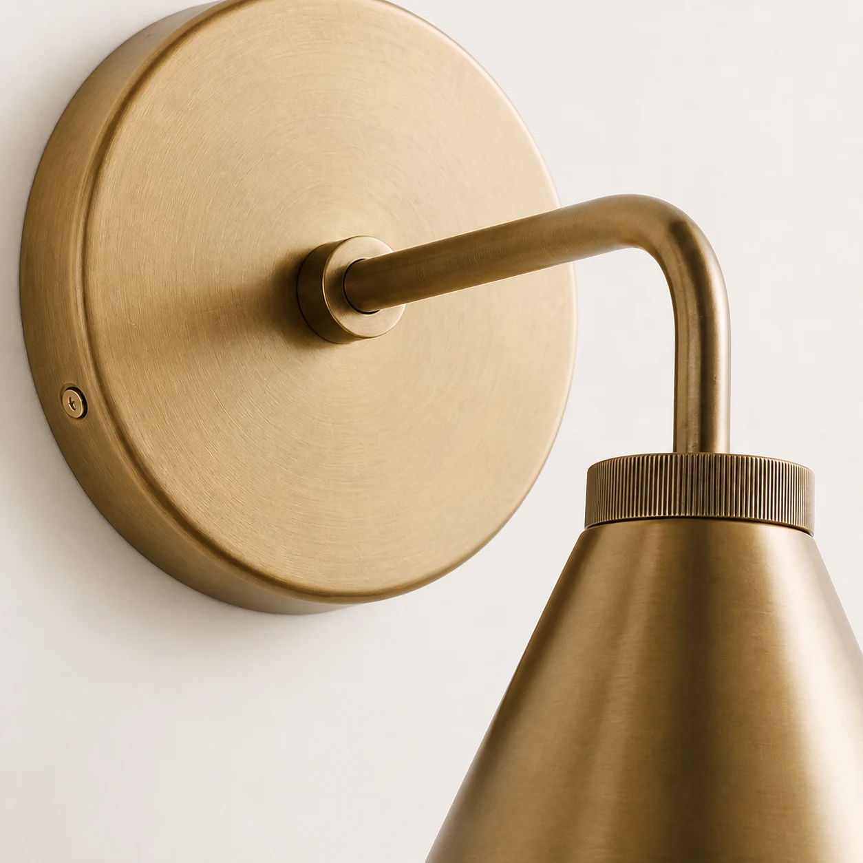 Close-up of Korvi wall lamp metal shade and finish detail