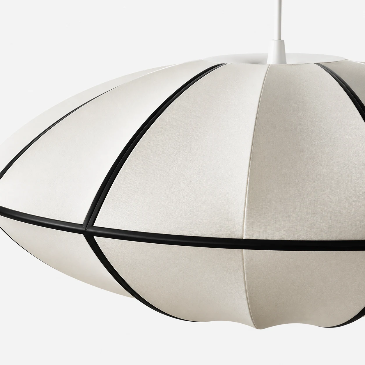 Close-up detail of the Orbina ribbon pendant shade and black frame