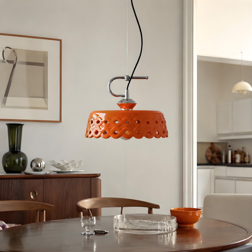 Orange pendant lamp in bright dining room