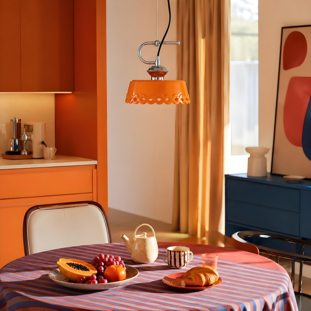 Orange pendant lamp over dining table in colorful interior