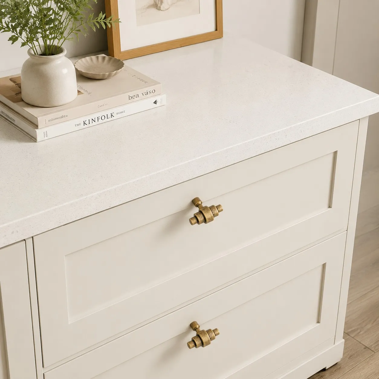 Antique brass handles installed on white drawers