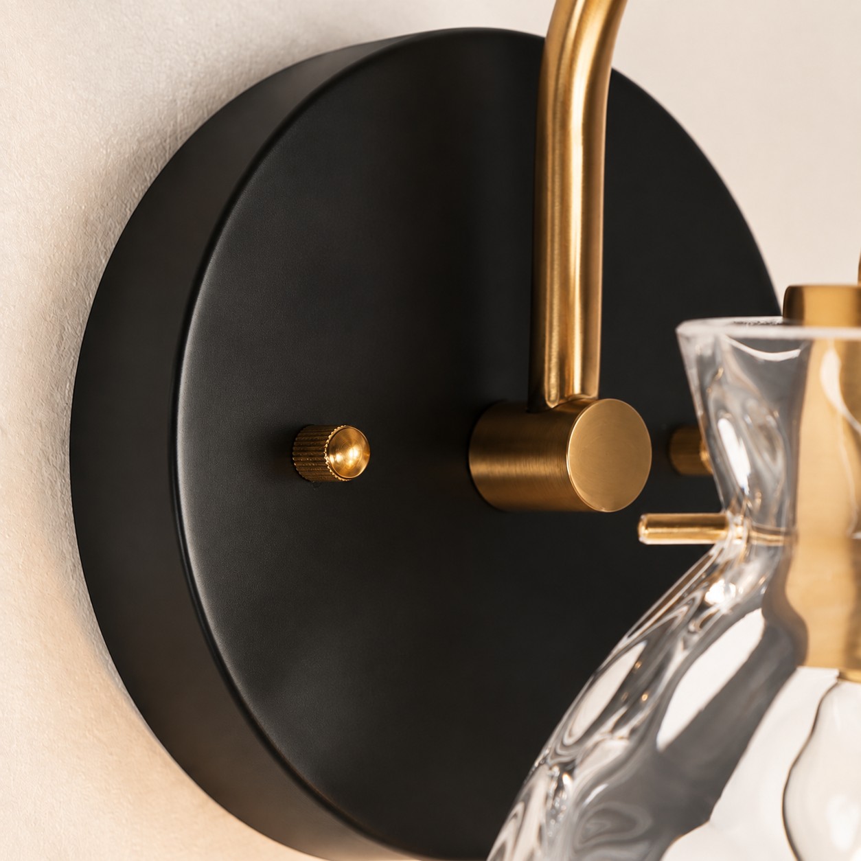 Brass Textured Clear | Glass Armed Wall Sconce — A layered perspective