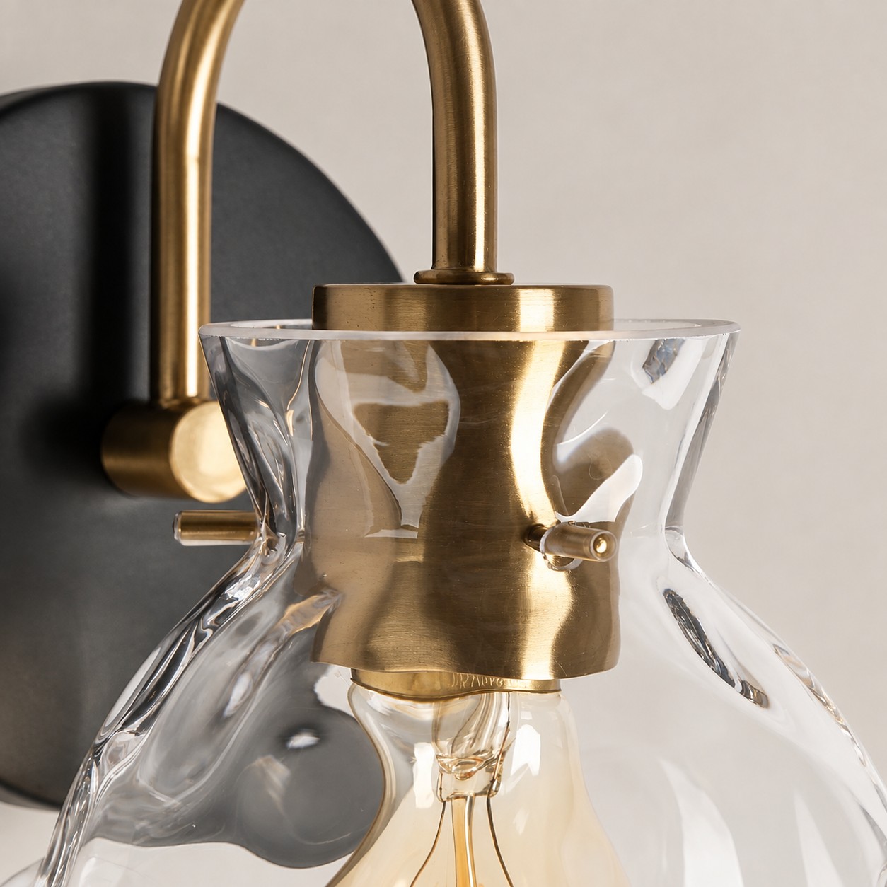 Brass Textured Clear | Glass Armed Wall Sconce — A layered perspective